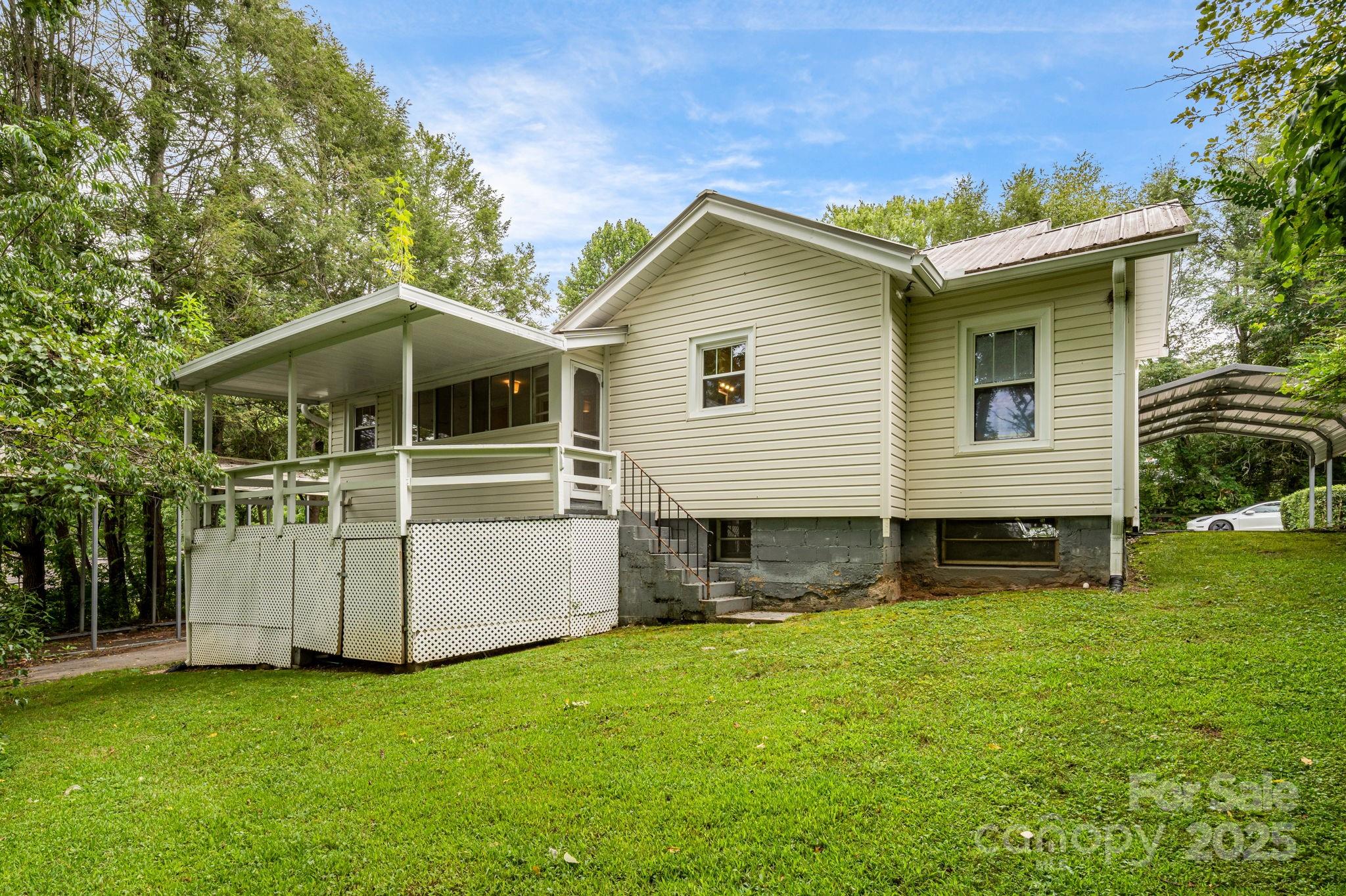 206 Rhododendron Drive Brevard, NC 28712 - Photo 29 of 36 a front view of a house with a yard
