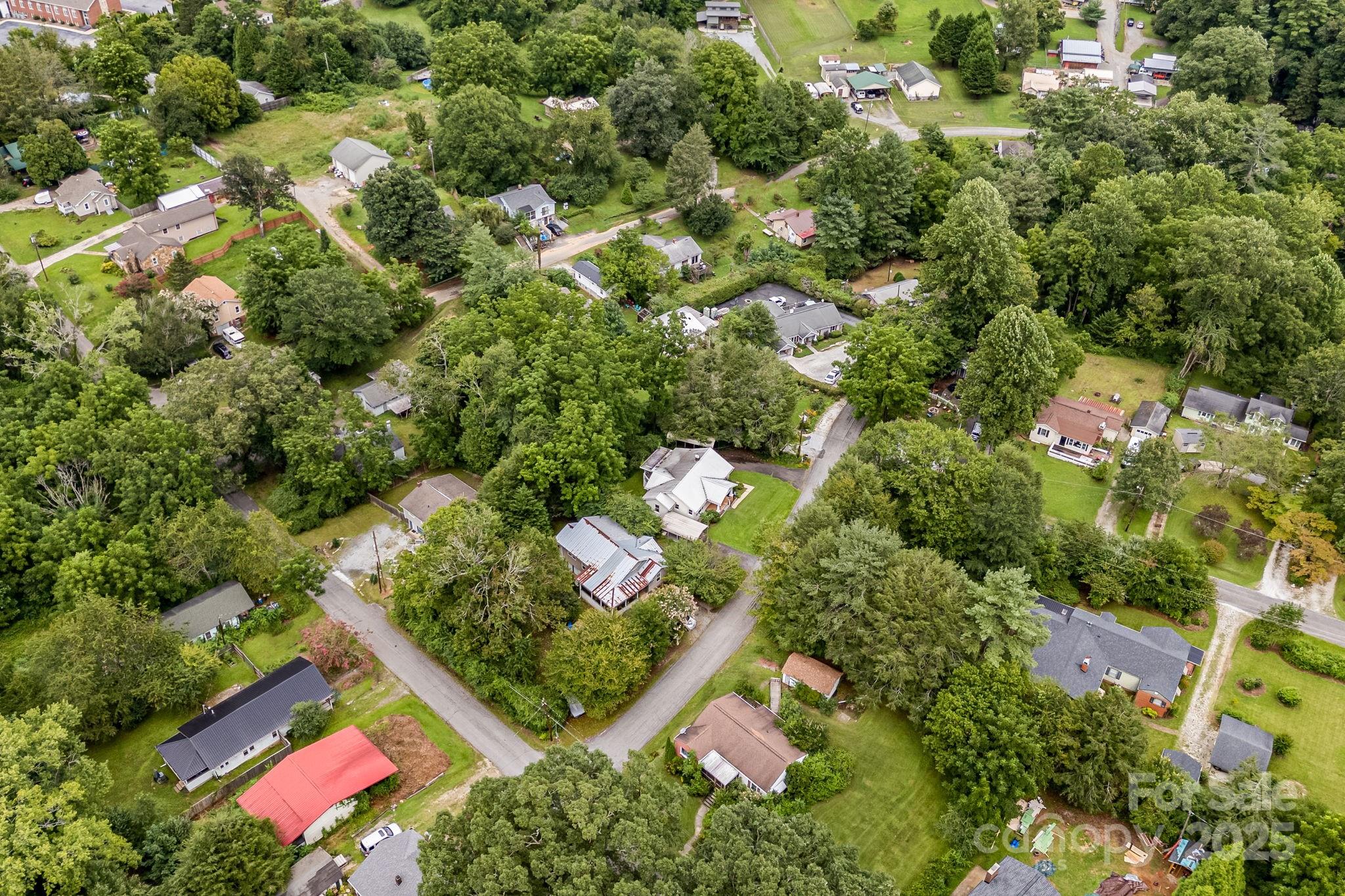 206 Rhododendron Drive Brevard, NC 28712 - Photo 31 of 36 an aerial view of residential house with outdoor space and trees all around