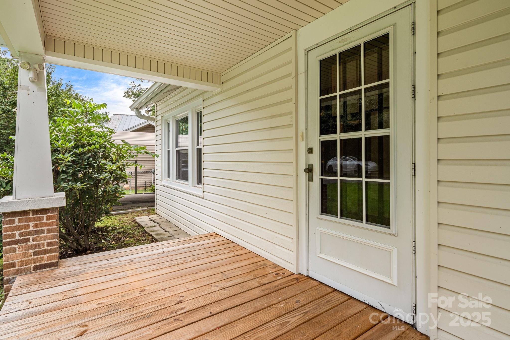 206 Rhododendron Drive Brevard, NC 28712 - Photo 7 of 36 a view of a house with a porch