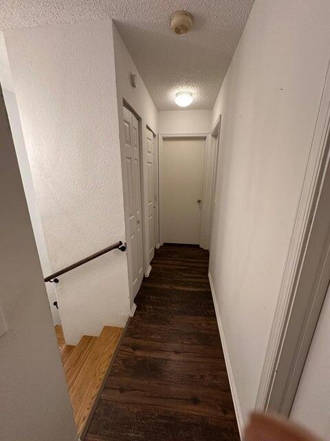 423 Waterside Circle Lake Worth, FL 33462 - Photo 11 of 21 a view of a hallway with wooden floor and staircase