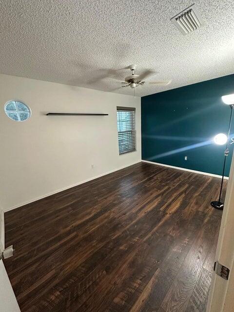 423 Waterside Circle Lake Worth, FL 33462 - Photo 13 of 21 a view of an empty room with a fireplace