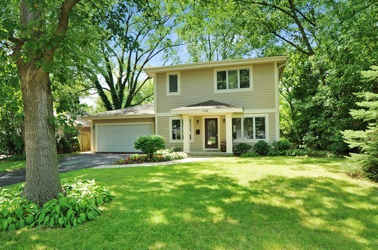 1132 Dell Road Northbrook, IL 60062 - Photo 1 of 20 a front view of house with yard and green space