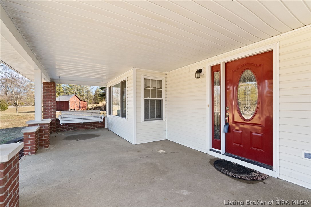 7368 West Relender Road Georgetown, IN 47122 - Photo 34 of 61 Spacious covered patio with porch swing that stays!