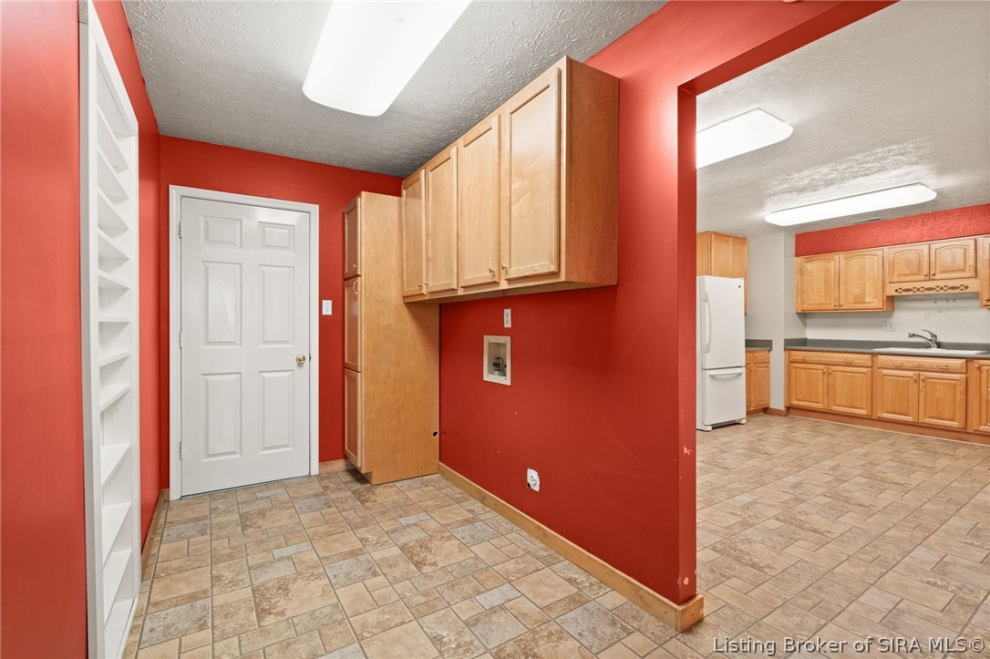 7368 West Relender Road Georgetown, IN 47122 - Photo 56 of 61 Laundry area with storage cabinets!
