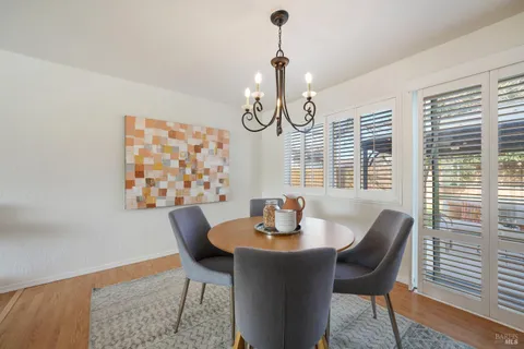a dining room with furniture and window