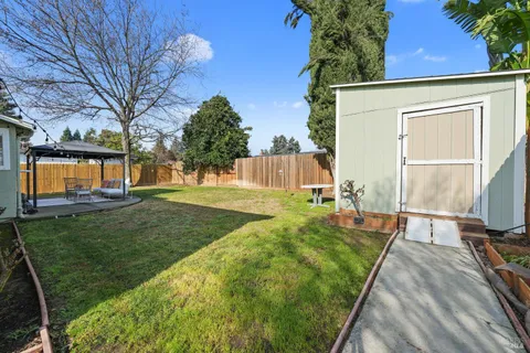 a view of a backyard with a garden