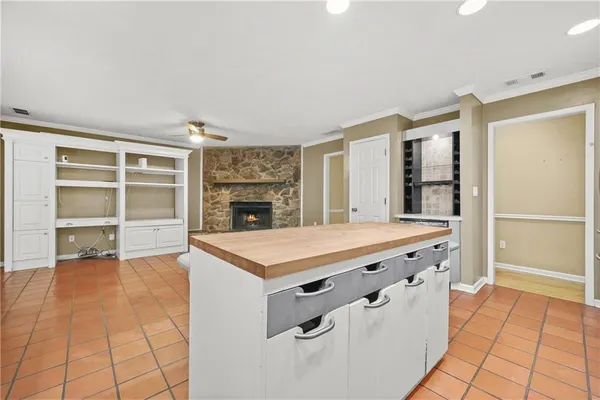 a kitchen with stainless steel appliances granite countertop a sink stove and cabinets