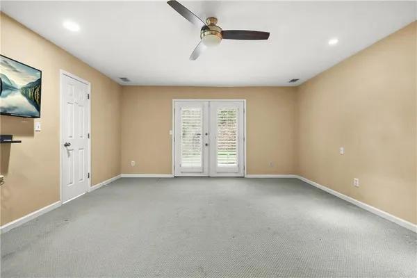 a view of empty room with windows