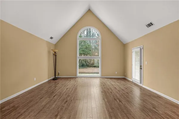 a view of a house with a yard and garage