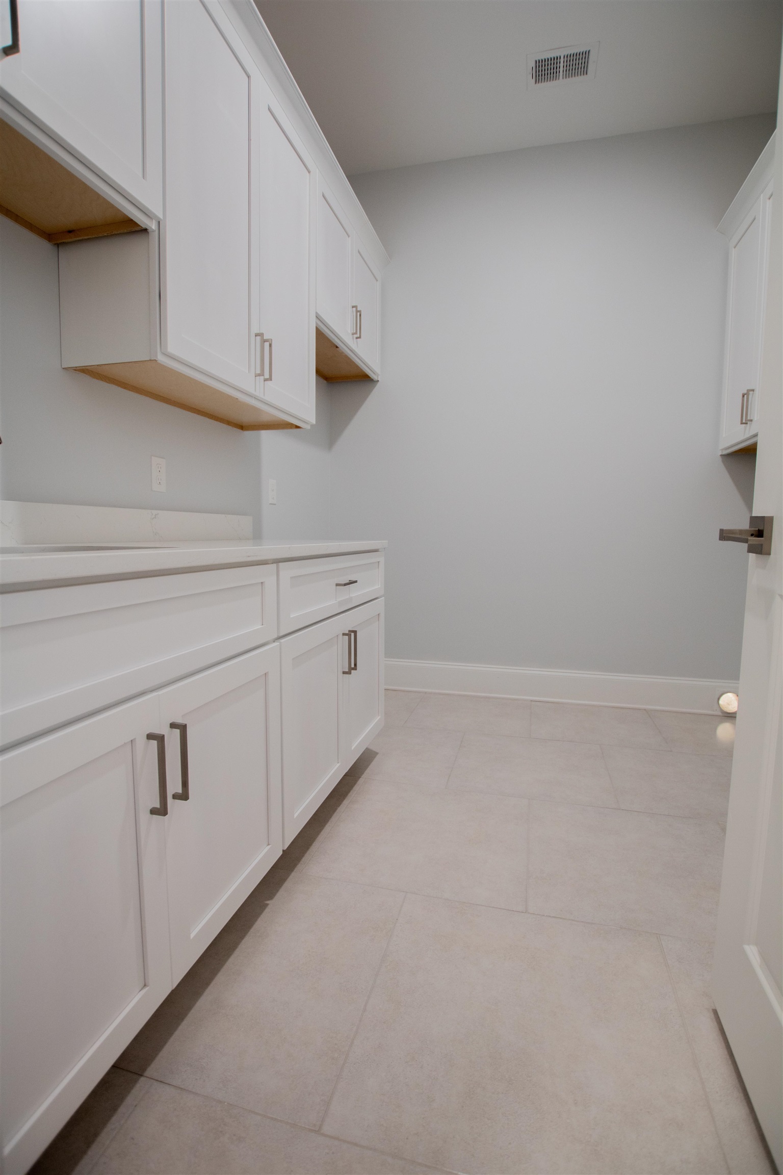 2611 Moore Road Germantown, TN 38138 - Photo 35 of 35 Interior space with white cabinets and light tile patterned floors