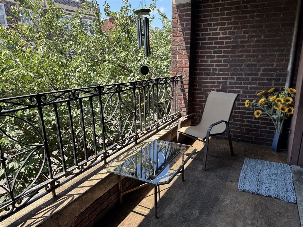 313 Summit Avenue, Unit 5 Boston, MA 02135 - Photo 10 of 13 a view of balcony with wooden floor