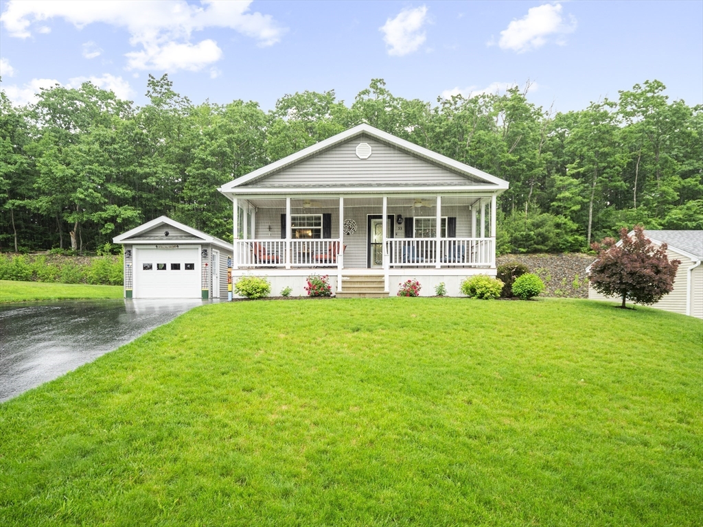 53 Ruby Road Gardner, MA 01440 - Photo 1 of 40 a view of a house with a yard and potted plants