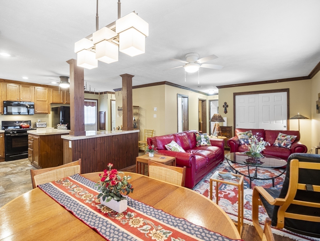 53 Ruby Road Gardner, MA 01440 - Photo 15 of 40 a living room with furniture a chandelier and a dining table