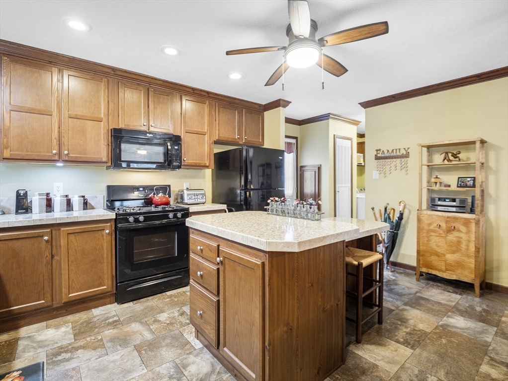 53 Ruby Road Gardner, MA 01440 - Photo 22 of 40 a kitchen with a stove a sink and a refrigerator