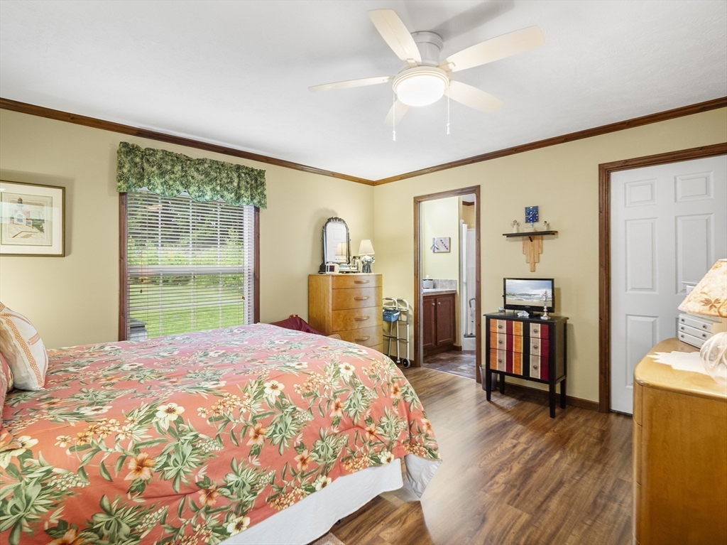 53 Ruby Road Gardner, MA 01440 - Photo 28 of 40 a bedroom with a large bed a flat tv screen and a dresser