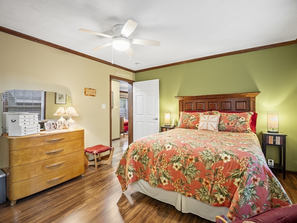 53 Ruby Road Gardner, MA 01440 - Photo 30 of 40 a bedroom with a bed and a chandelier