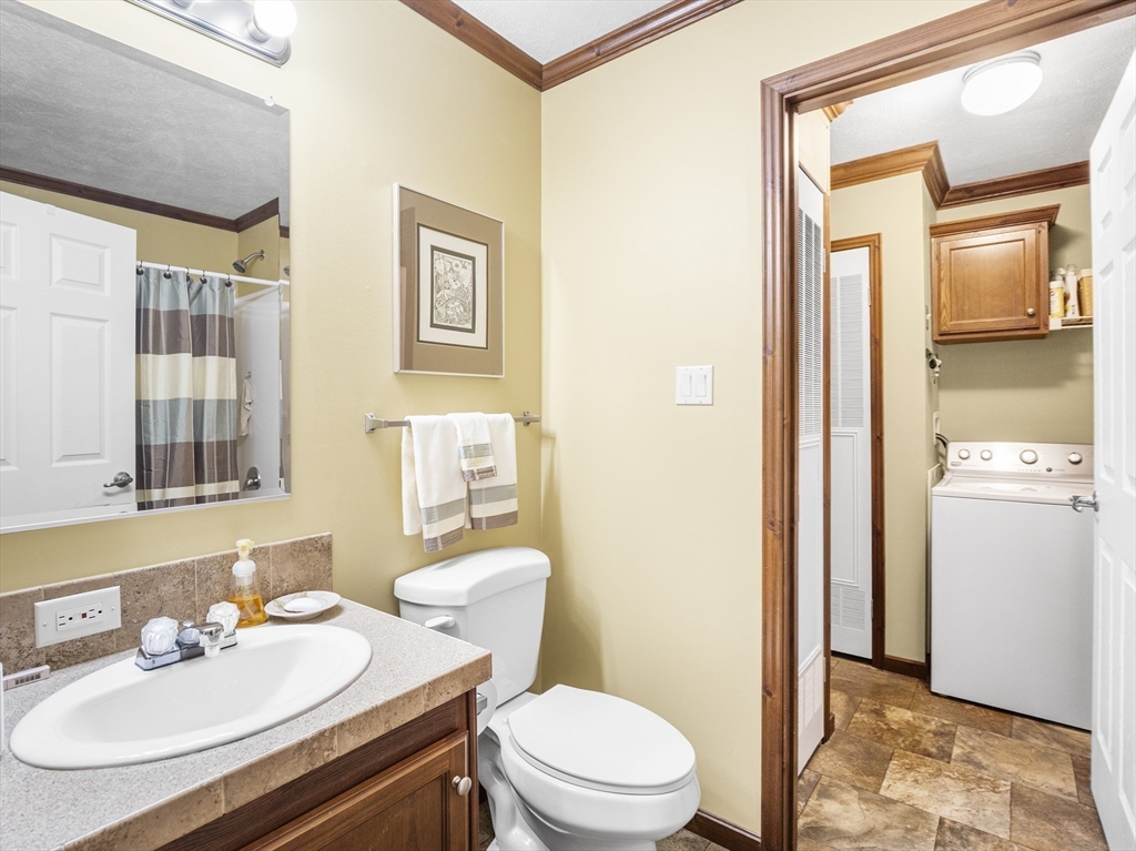 53 Ruby Road Gardner, MA 01440 - Photo 33 of 40 a bathroom with a sink a toilet a mirror and shower