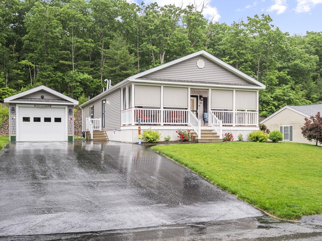 53 Ruby Road Gardner, MA 01440 - Photo 37 of 40 a front view of a house with garden