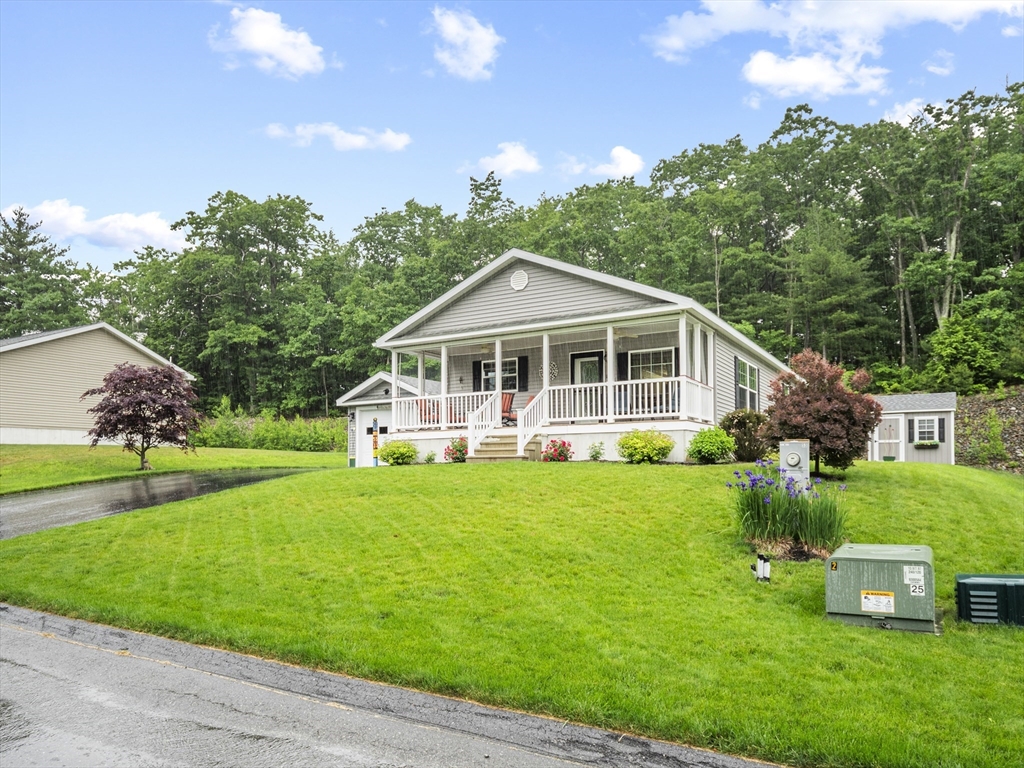 53 Ruby Road Gardner, MA 01440 - Photo 38 of 40 a front view of a house with a yard table and chairs