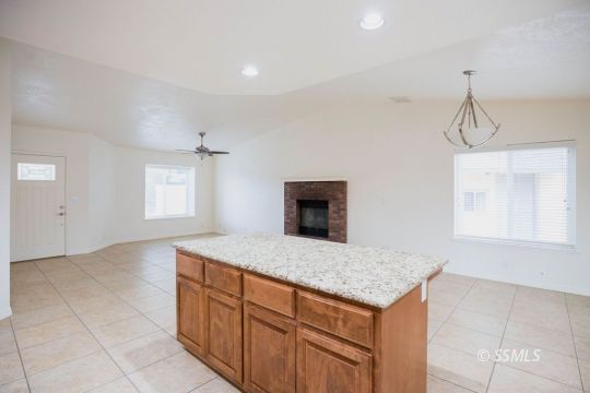 437 Emily Street Ridgecrest, CA 93555 - Photo 10 of 28 a bathroom with a granite countertop sink and a mirror