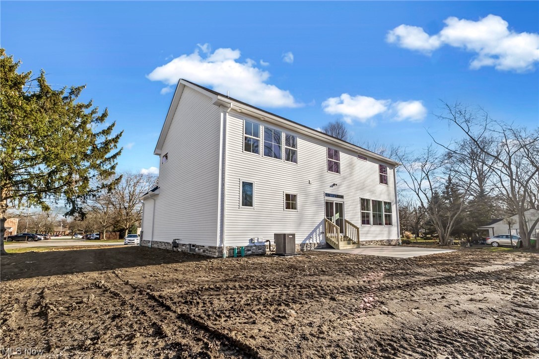 812 Ford Road Cleveland, OH 44143 - Photo 10 of 20 Rear view of property featuring central air condition unit