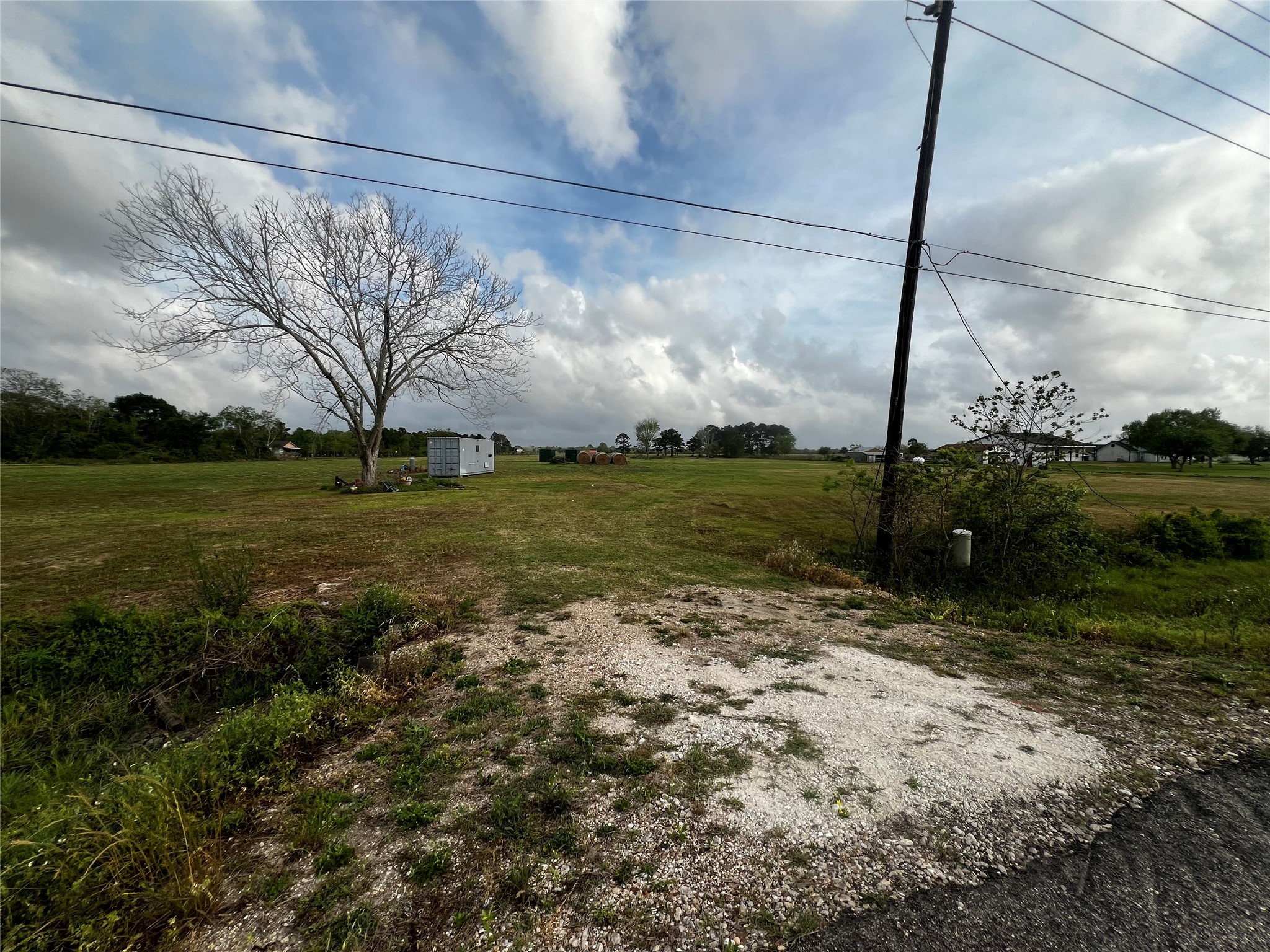 9715 County Road 171 Liverpool, TX 77577 - Photo 8 of 9 a view of a field with a big yard