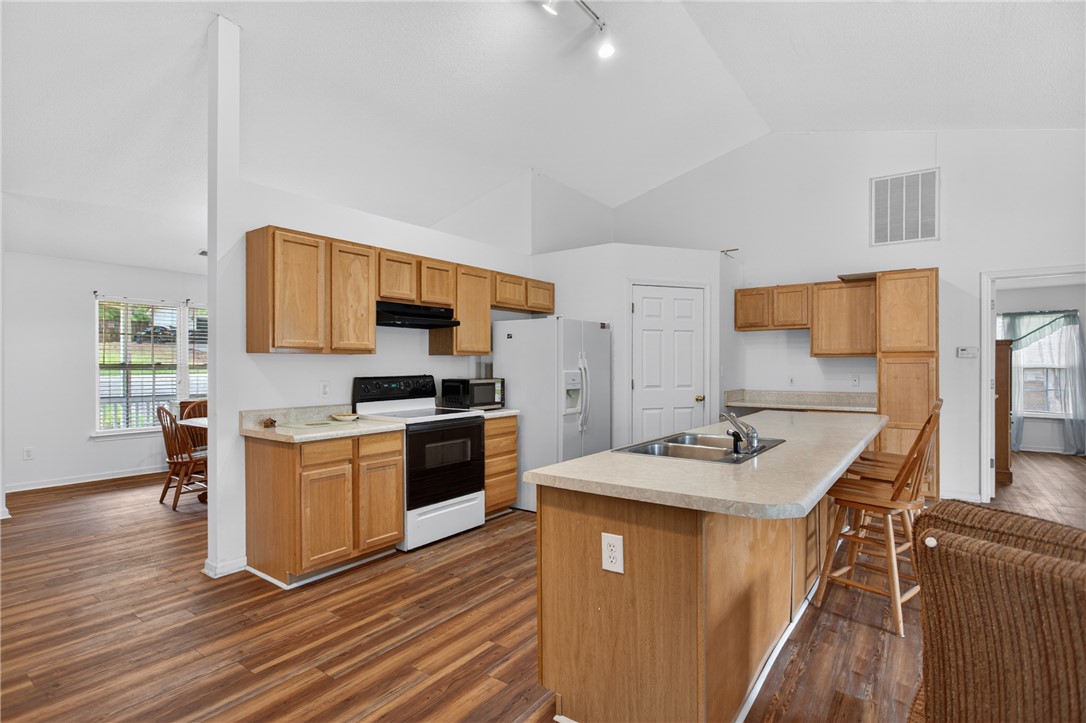 207 Hunters Lane Anderson, SC 29625 - Photo 14 of 46 Prepare meals in this light-filled kitchen, featuring ample counter space and an inviting breakfast bar.