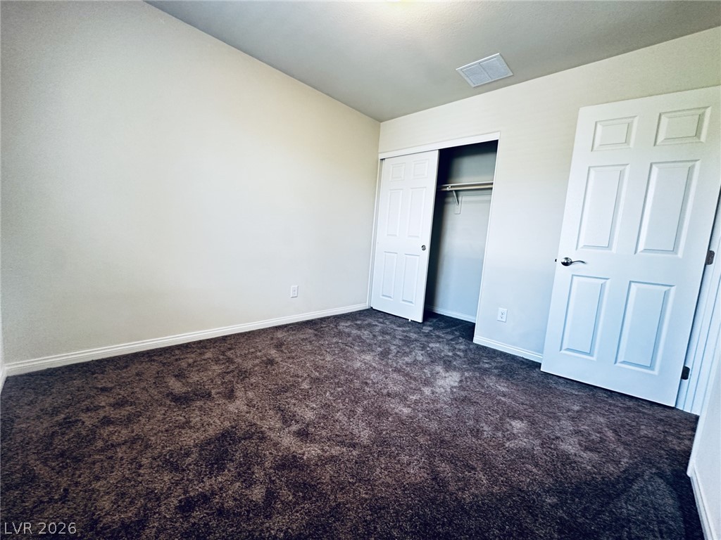 7331 Sunray Point Street North Las Vegas, NV 89084 - Photo 9 of 20 A spacious bedroom provides a blank canvas for personalization with rich, deep-pile carpeting.