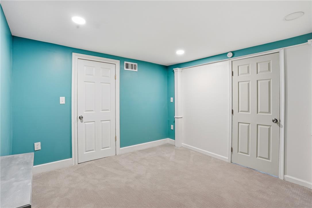 6271 Batman Road Zionsville, PA 18092 - Photo 57 of 100 A versatile room with soft carpeting and recessed lighting, ready for your personal touch.