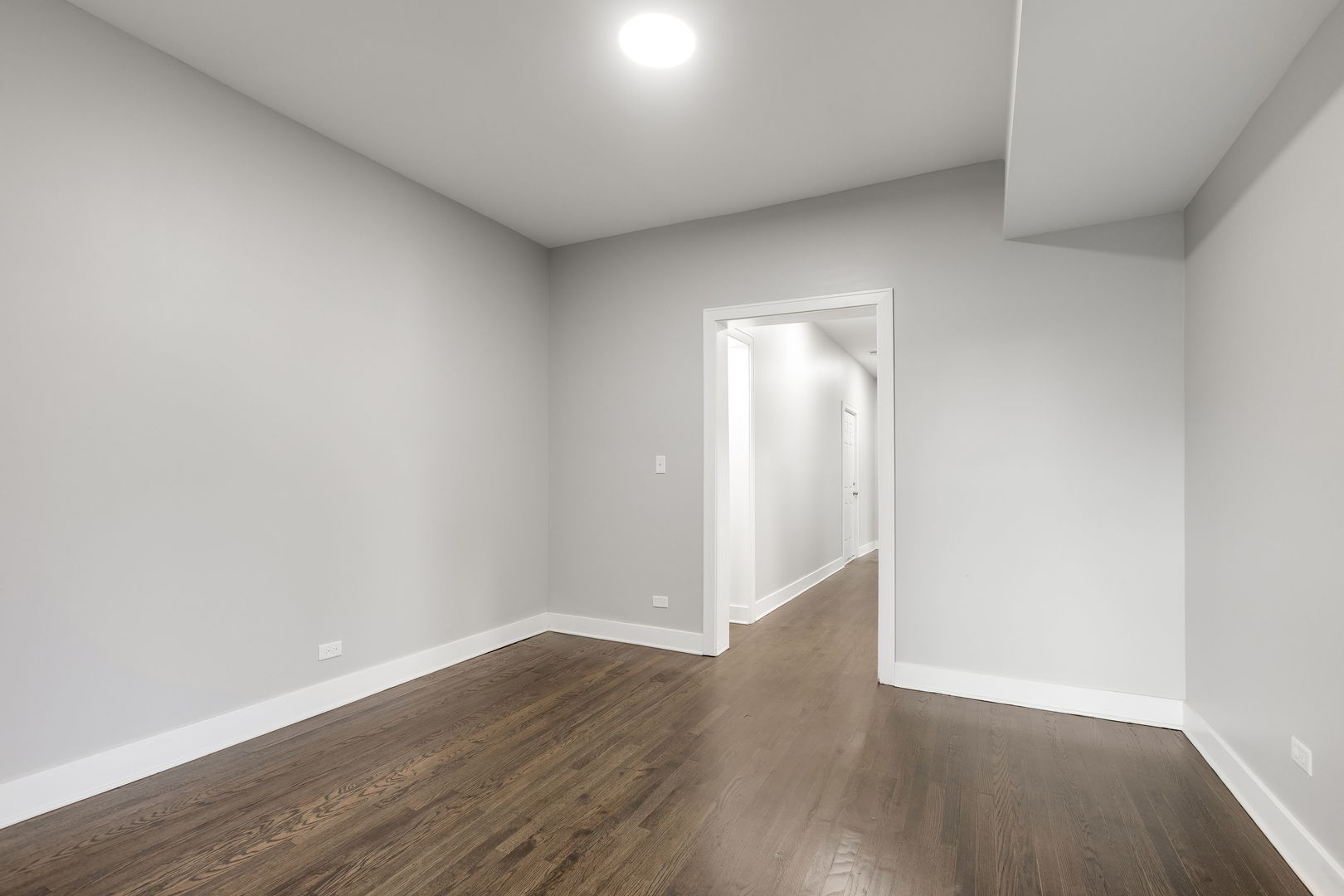 7753 South Morgan Street, Unit 3 Chicago, IL 60620 - Photo 8 of 13 a view of an empty room with wooden floor