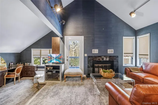 a living room with furniture and large windows