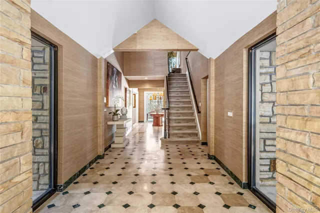 a living room with furniture wooden floor and a fireplace