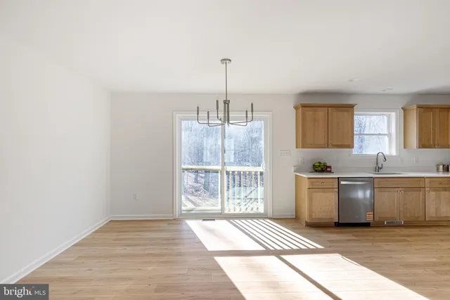 a kitchen with a sink cabinets and window