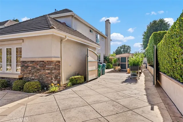 a view of a dining room with furniture and a chandelier