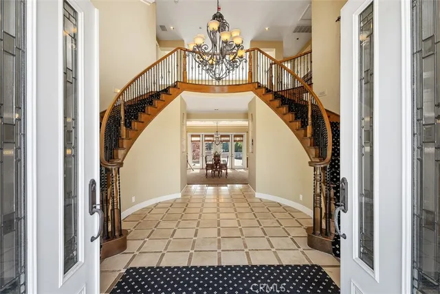 a living room with furniture a large window and a fireplace