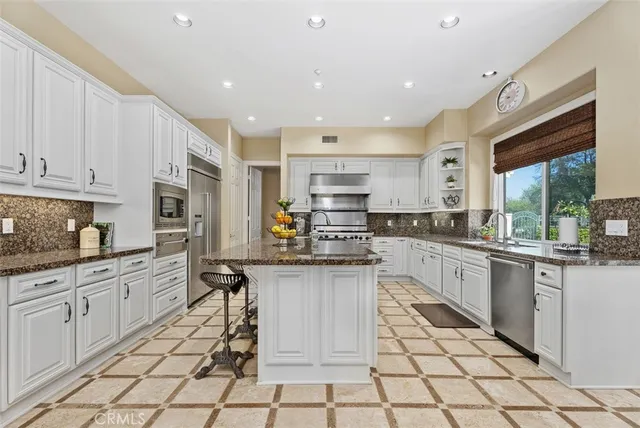 a living room with furniture pool table and a window
