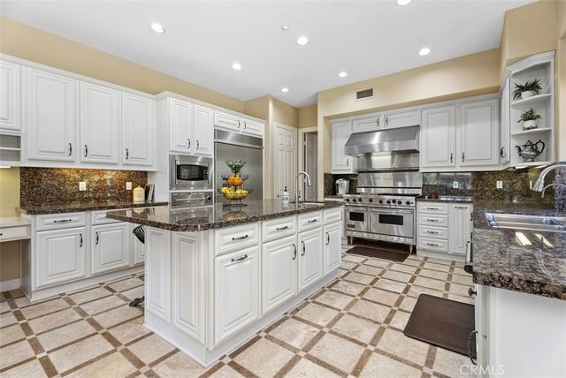 a blue bed sitting in a room next to a window
