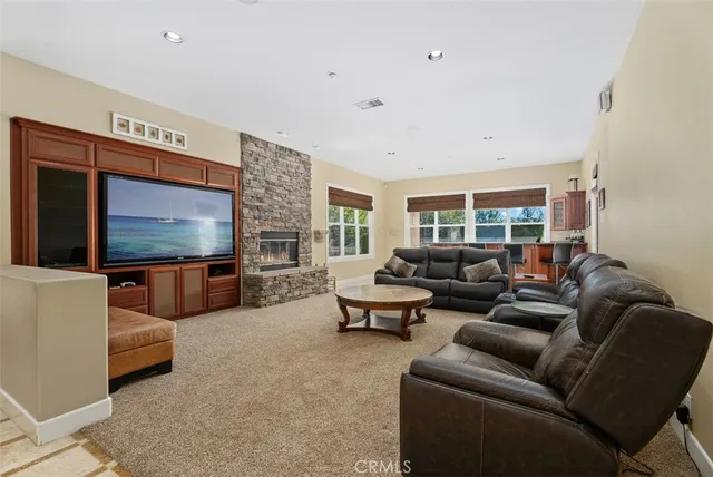 a bathroom with a granite countertop sink a toilet and shower
