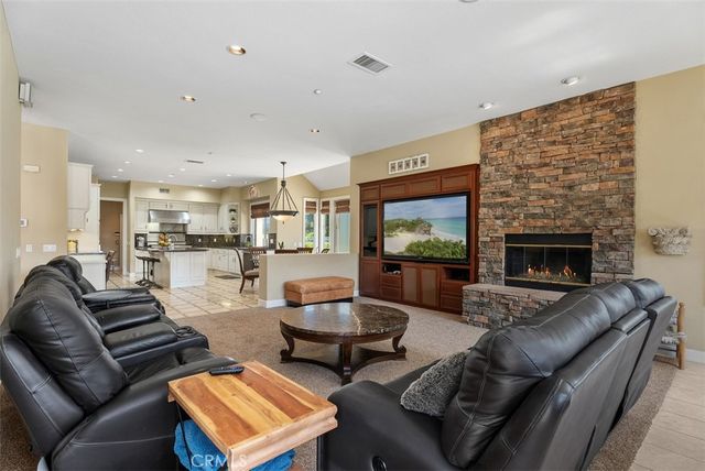 a spacious bedroom with a bed and a couch