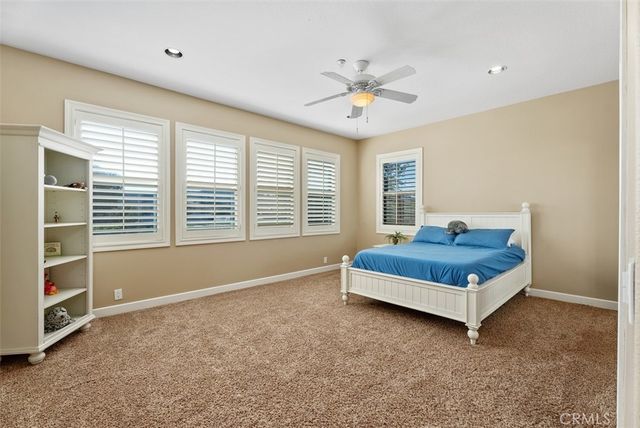 a spacious bathroom with a tub sink and mirror