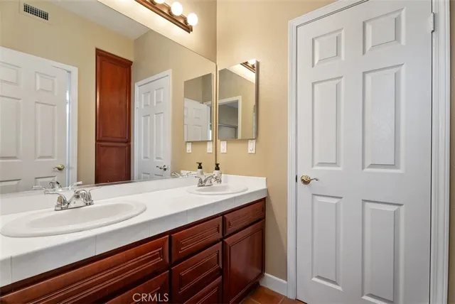 a view of a large body of water with a house in the background
