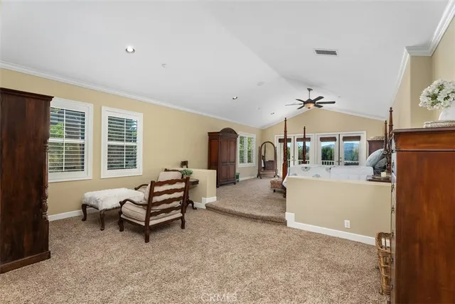 a front view of a house with swimming pool having outdoor seating