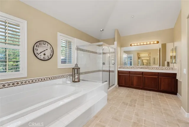 a aerial view of a house with a garden and lake view