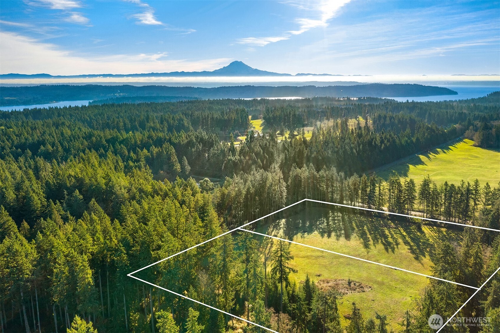 a view of a swimming pool and an outdoor seating