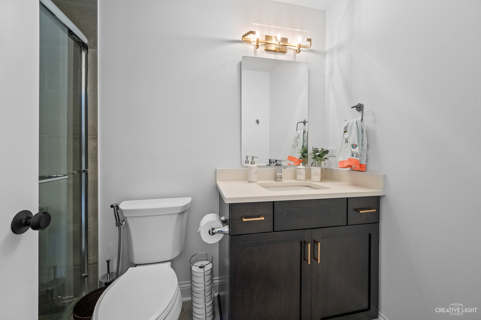 601-1 Harger Road Oak Brook, IL 60523 - Photo 15 of 29 a bathroom with a sink vanity mirror and toilet