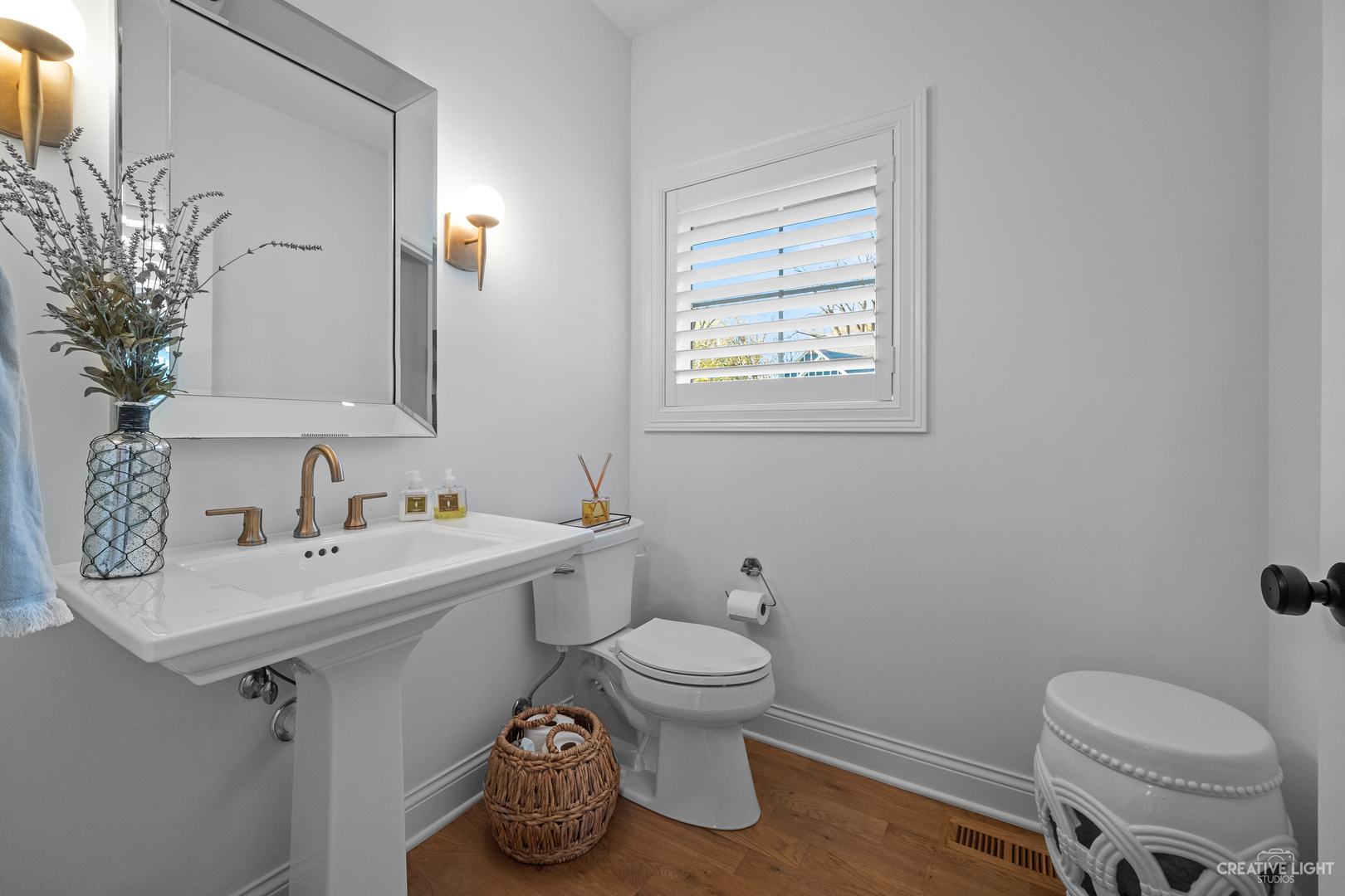 601-1 Harger Road Oak Brook, IL 60523 - Photo 18 of 29 a bathroom with a toilet sink and mirror