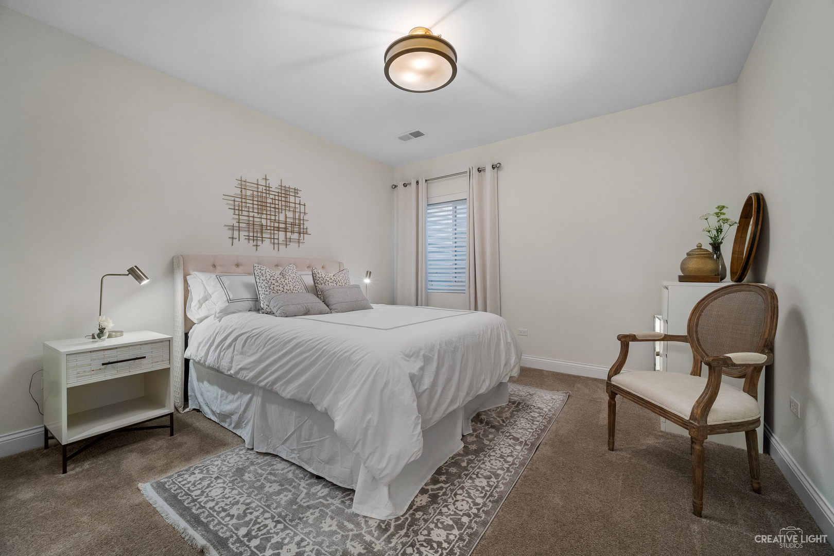 601-1 Harger Road Oak Brook, IL 60523 - Photo 19 of 29 a bedroom with a bed and chair