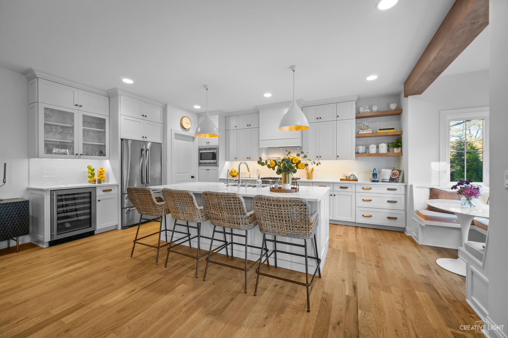 601-1 Harger Road Oak Brook, IL 60523 - Photo 2 of 29 a kitchen with stainless steel appliances kitchen island granite countertop a stove a sink a dining table and chairs