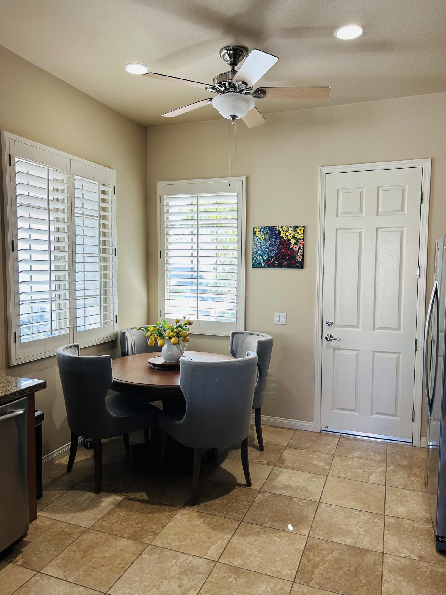 81602 Avenida Alturas Indio, CA 92203 - Photo 12 of 31 a view of a dining room with furniture and a window