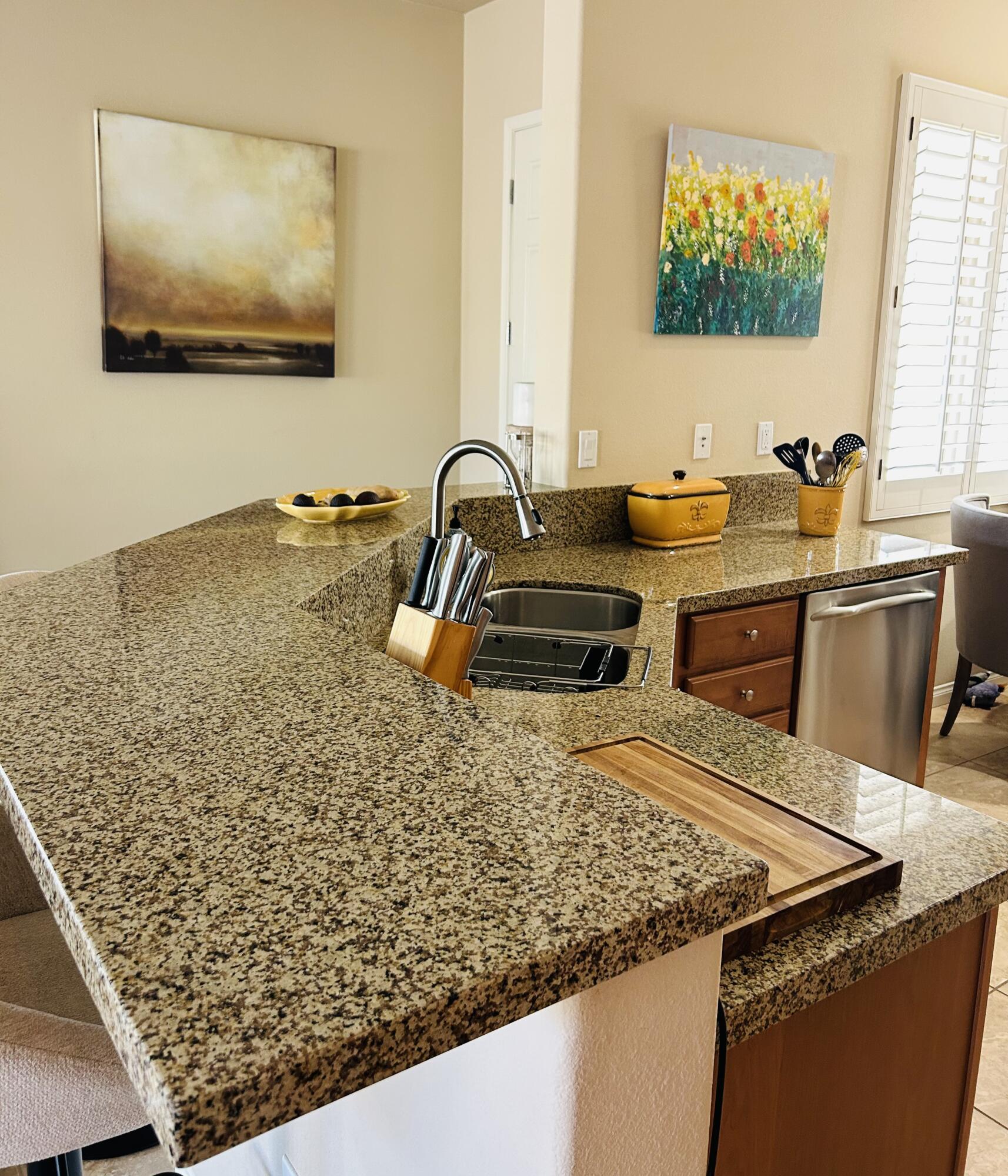 81602 Avenida Alturas Indio, CA 92203 - Photo 14 of 31 a view of a kitchen with a sink and wooden floor